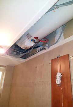 Intégration du chauffe-eau dans le faux-plafond